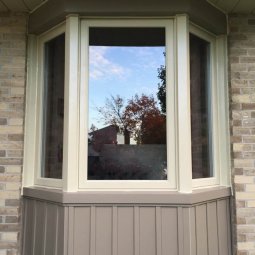 bay window fixed casement flashing siding beige tan brown