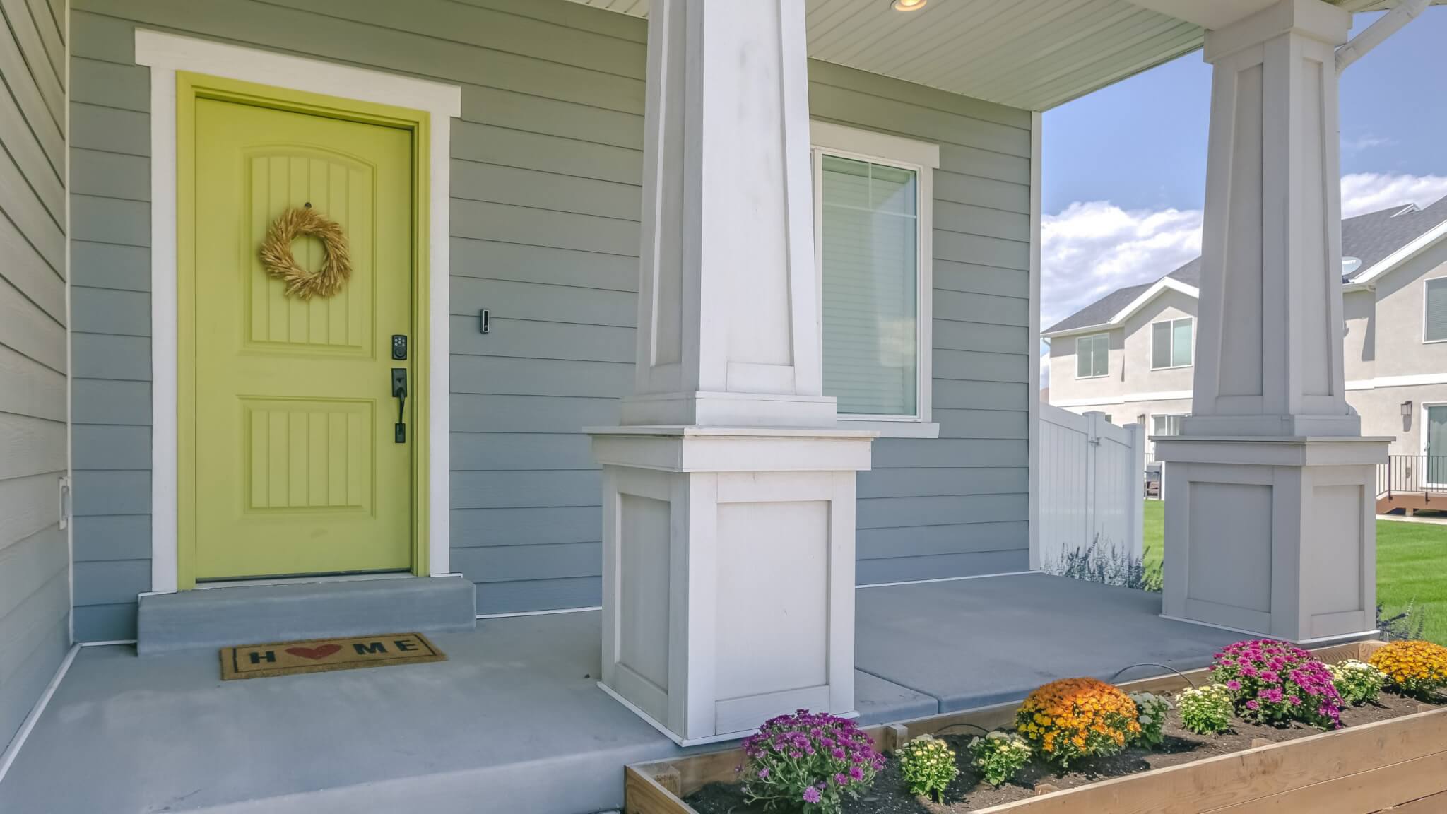 Home with porch and flowers in the garden