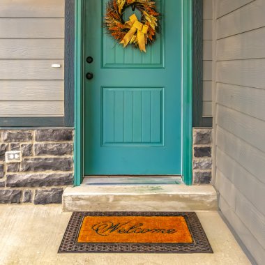 a blue door with fall décor