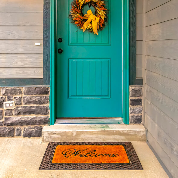 a blue door with fall décor