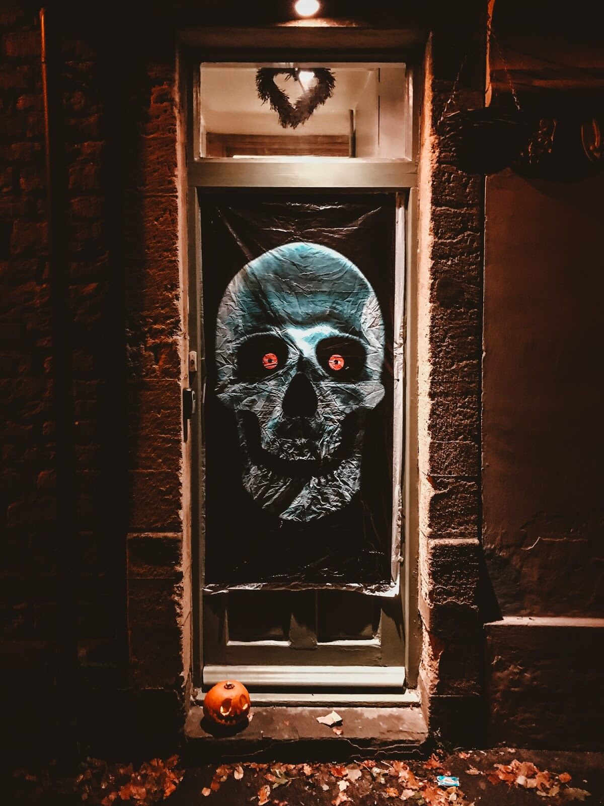 a front door with a skeleton decoration