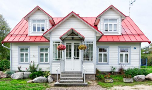 A white house with a red roof.